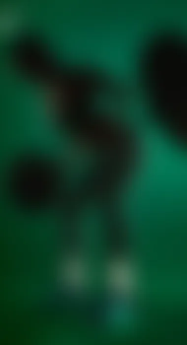 Blurred green silhouette of an athlete lifting a barbell